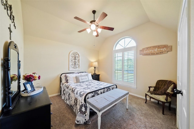 bedroom featuring lofted ceiling, baseboards, and dark carpet