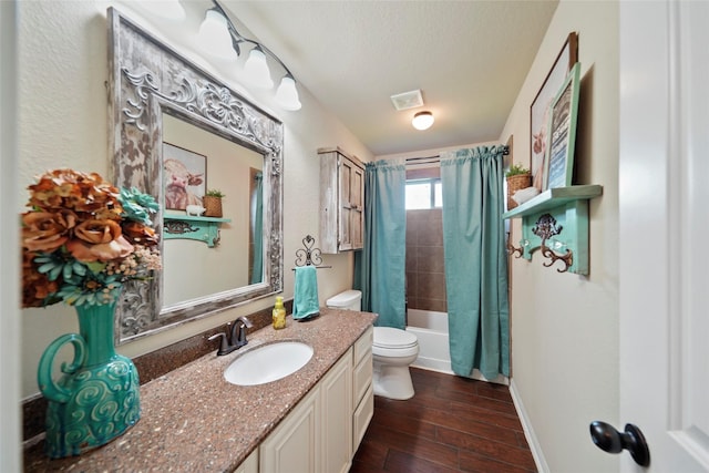 full bathroom with shower / bath combination with curtain, toilet, a textured ceiling, wood finished floors, and baseboards