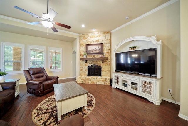 living room featuring baseboards, a fireplace, dark wood finished floors, and crown molding