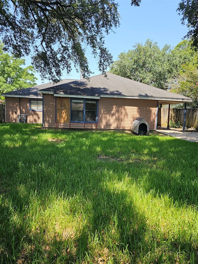 back of house with a yard