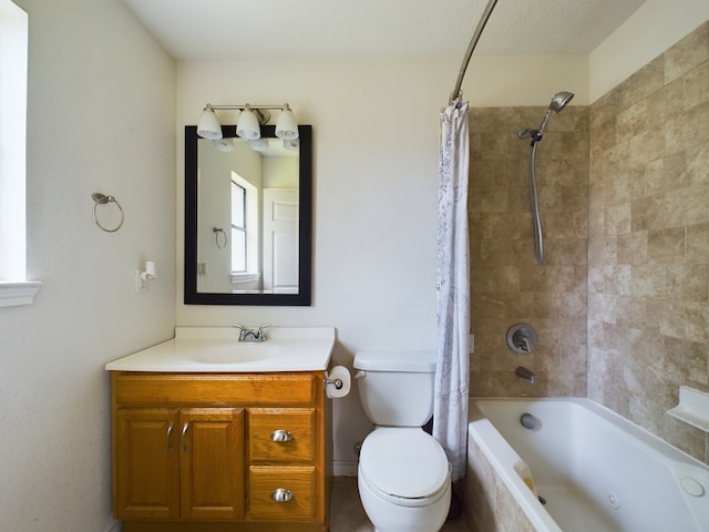 full bathroom with vanity, toilet, and shower / bath combo with shower curtain