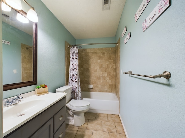 full bathroom featuring tile patterned floors, vanity, toilet, and shower / tub combo with curtain