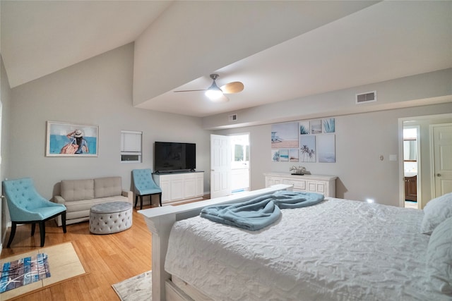 bedroom featuring high vaulted ceiling, light hardwood / wood-style floors, and ceiling fan