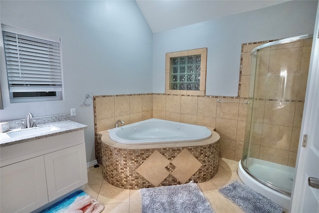 bathroom featuring tile flooring, vanity, and independent shower and bath