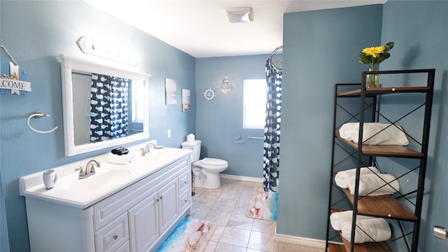 bathroom featuring tile flooring, oversized vanity, and toilet