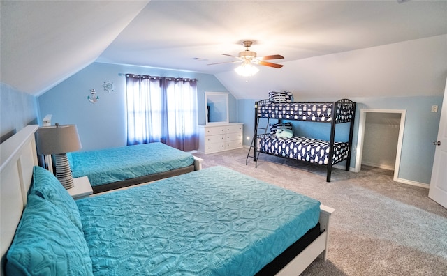 carpeted bedroom featuring ceiling fan and vaulted ceiling