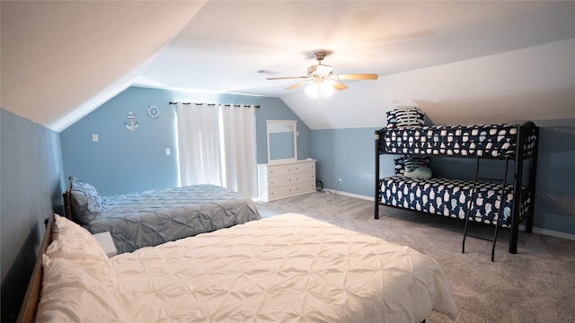 carpeted bedroom with vaulted ceiling and ceiling fan