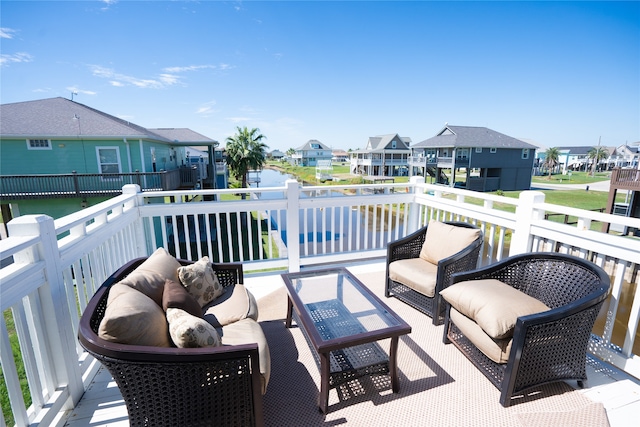 wooden balcony featuring an outdoor hangout area and a wooden deck