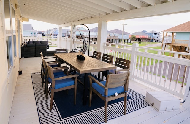 wooden deck featuring an outdoor living space