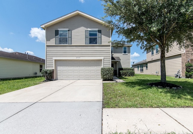 front of property featuring a garage and a front yard