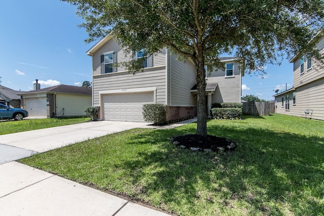 view of front of home featuring a front lawn and a garage