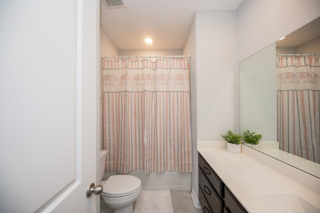 full bathroom with shower / bath combo, tile patterned floors, vanity, and toilet