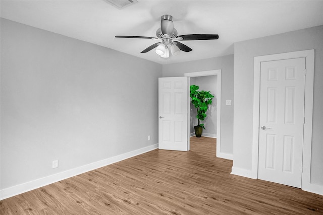 unfurnished bedroom featuring ceiling fan and wood-type flooring