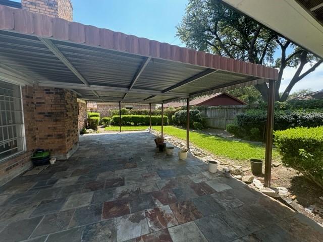 view of patio featuring a carport