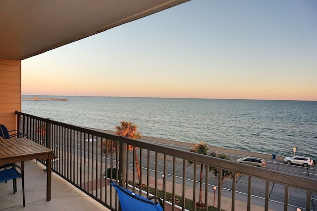 balcony at dusk with a water view