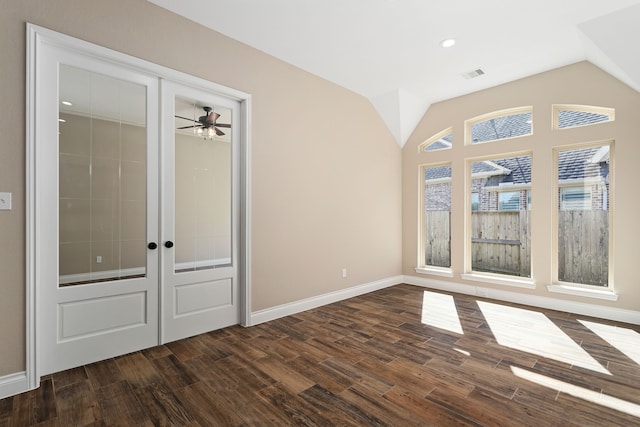 interior space with ceiling fan, french doors, dark wood-type flooring, and vaulted ceiling