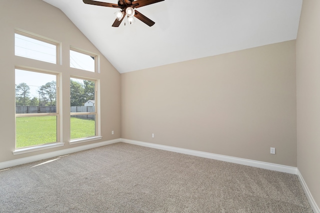 unfurnished room featuring carpet floors, vaulted ceiling, and ceiling fan