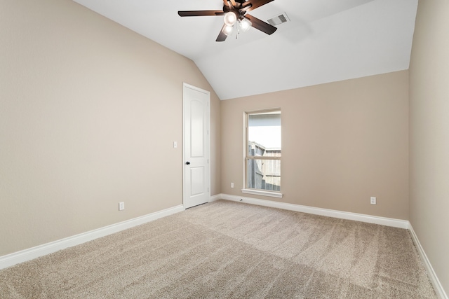 empty room with light carpet, ceiling fan, and lofted ceiling