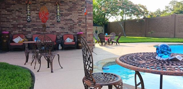 view of patio with a fenced in pool