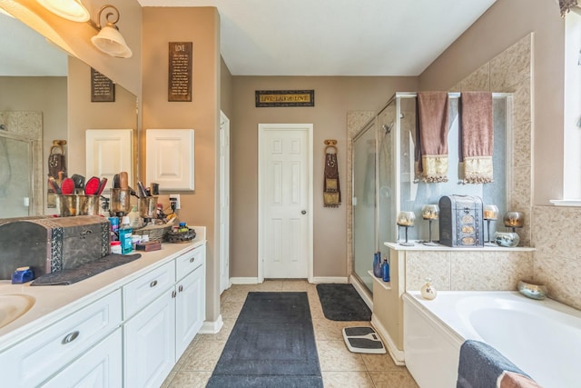 bathroom featuring tile patterned flooring, vanity, and separate shower and tub