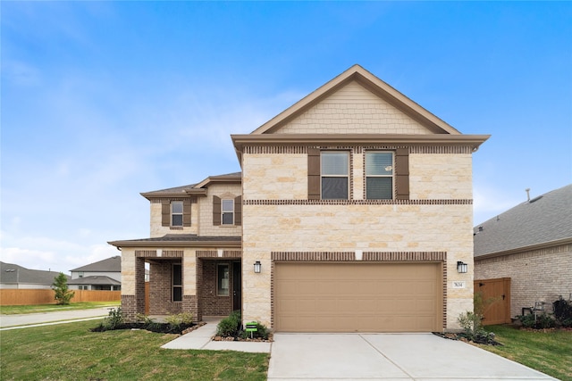 view of front of home with a garage and a front lawn