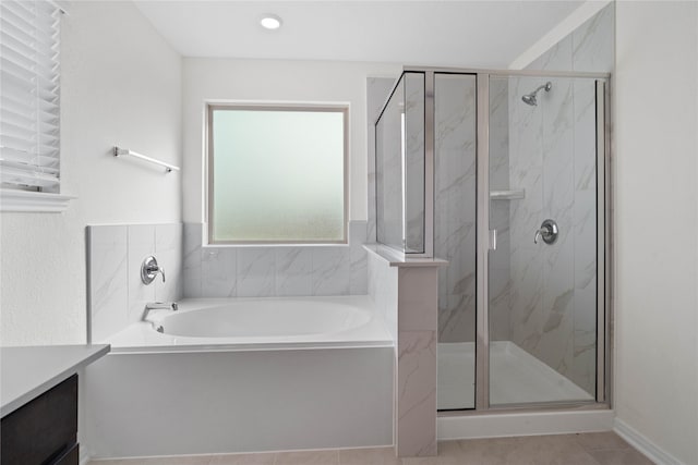 bathroom featuring tile patterned flooring and plus walk in shower