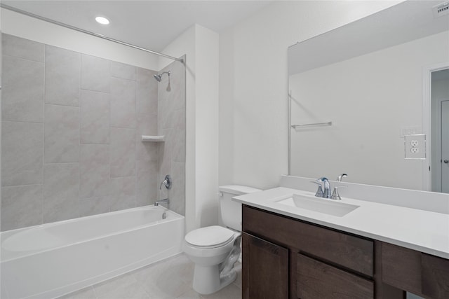 full bathroom featuring tile patterned flooring, vanity, toilet, and tiled shower / bath