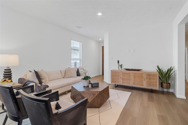 living room with light hardwood / wood-style flooring