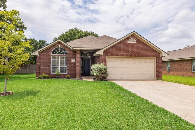 ranch-style house with a front yard and a garage