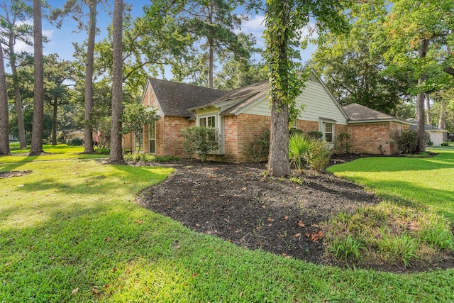 view of home's exterior featuring a lawn