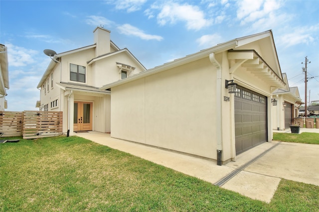 view of front of property with a garage and a front yard