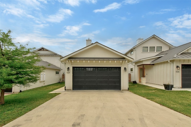 view of front facade with a front yard and a garage