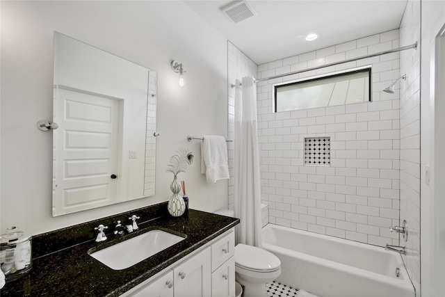 full bathroom with tile floors, large vanity, toilet, and shower / tub combo with curtain