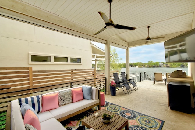 view of terrace featuring outdoor lounge area, ceiling fan, and a water view