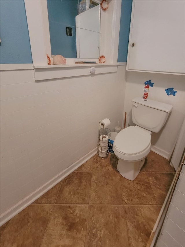 bathroom featuring tile patterned floors and toilet