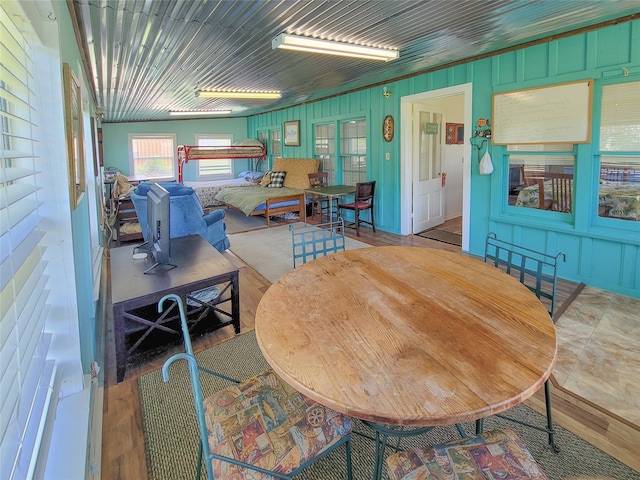 dining space with wood-type flooring