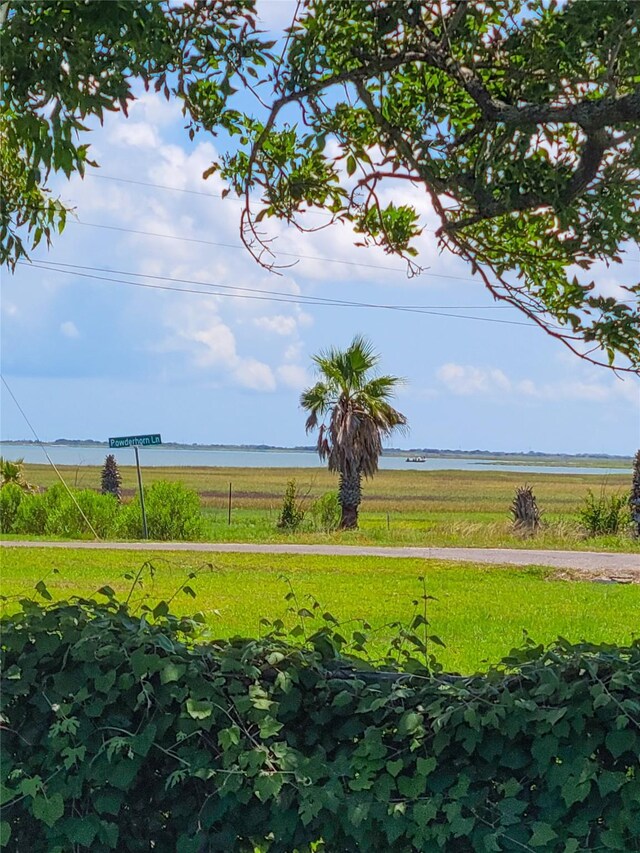 view of yard featuring a water view and a rural view