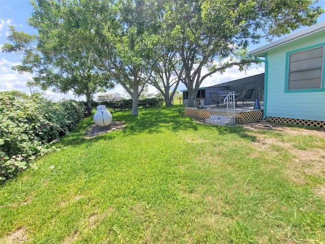 view of yard featuring a wooden deck