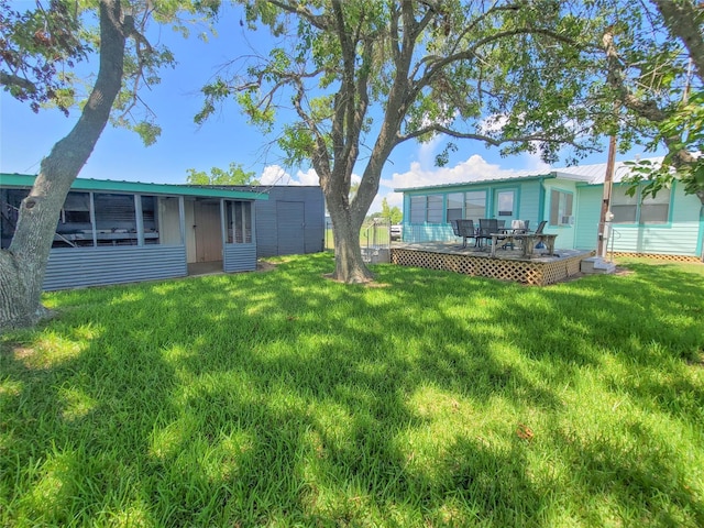 view of yard featuring a sunroom