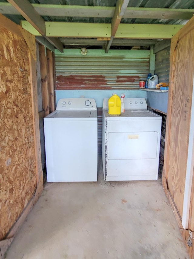 clothes washing area featuring separate washer and dryer