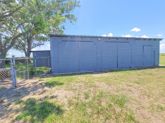 view of outbuilding featuring a yard