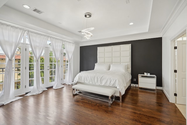 bedroom with hardwood / wood-style flooring, french doors, and access to exterior