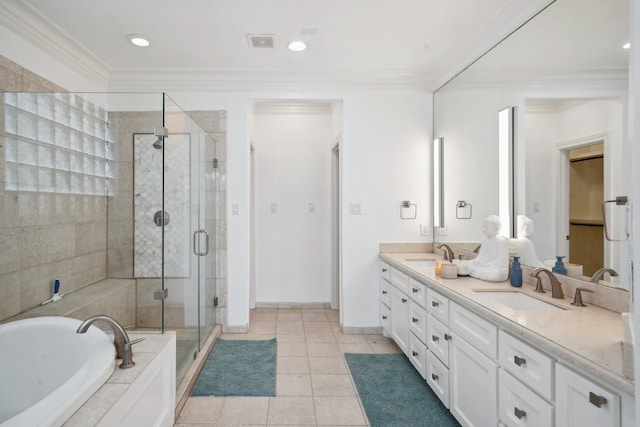 bathroom featuring independent shower and bath, crown molding, dual bowl vanity, and tile patterned floors