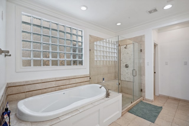 bathroom featuring independent shower and bath, ornamental molding, and tile patterned flooring