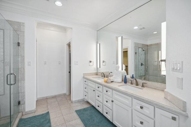 bathroom featuring walk in shower, crown molding, tile patterned flooring, and double sink vanity