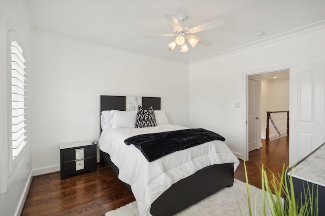 bedroom featuring dark hardwood / wood-style floors, ceiling fan, and ornamental molding