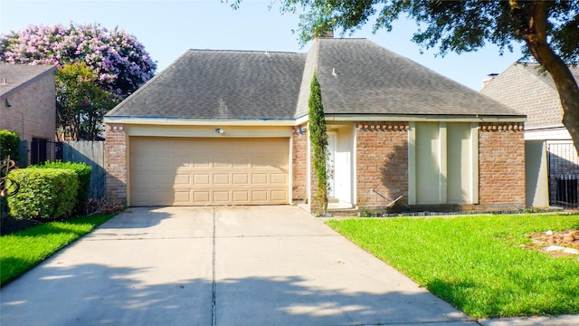 view of front of house with a garage and a front yard