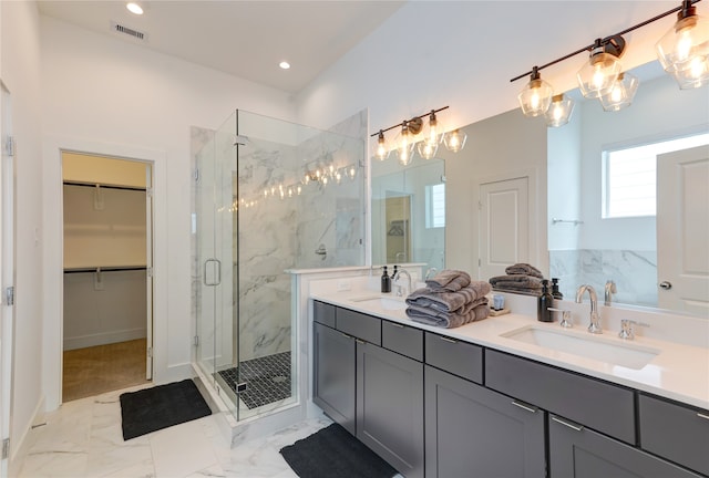 bathroom with tile floors, walk in shower, and dual vanity