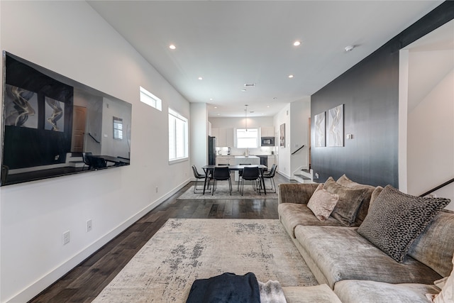 living room featuring dark hardwood / wood-style flooring