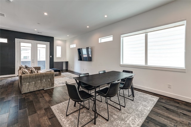 dining room featuring french doors and dark hardwood / wood-style floors